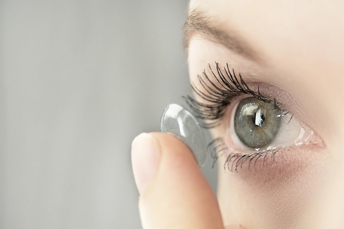 placing_contact_lens_in_eye close-up of someone placing contact lens into eye